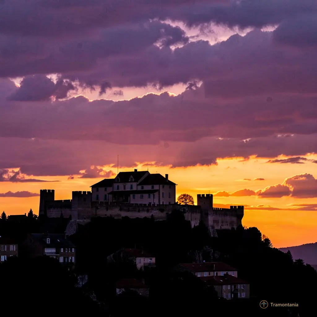 Sunset view of the Salses fortress silhouette against a purple and orange sky